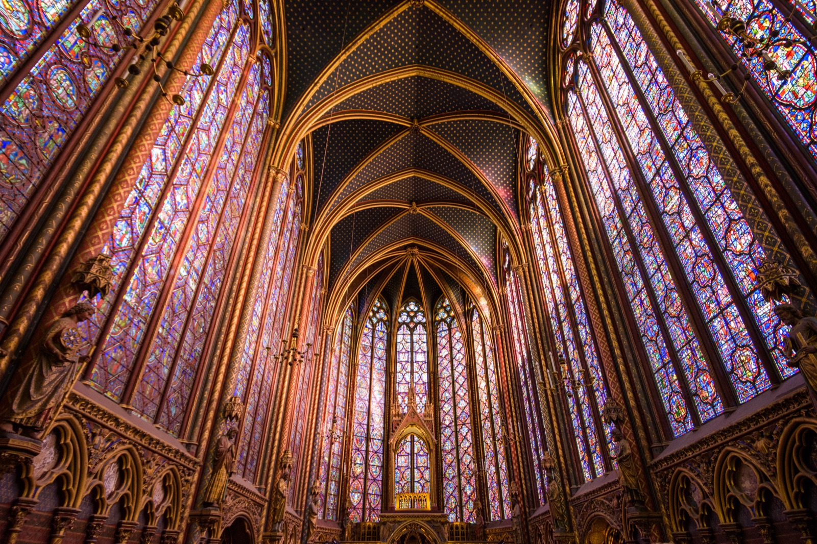 Sainte-Chapelle upper chapel with soaring stained glass windows and gilded vaulted ceiling, Paris